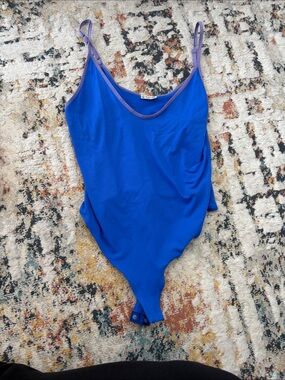 Girls Blue One-Piece Bodysuit with Purple Trim